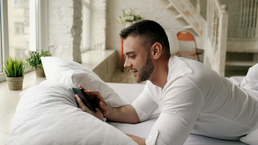 Man waking up rested and refreshed after quality sleep