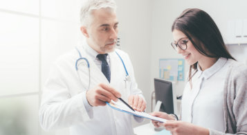 Sleep specialist reviewing apnea treatment plan with patient