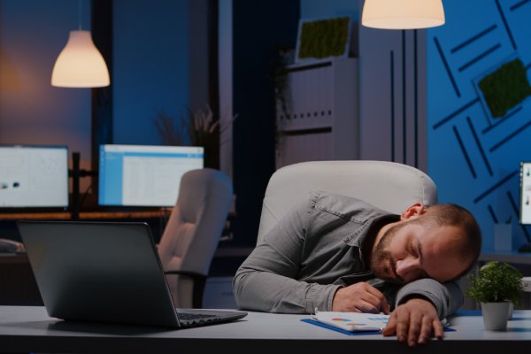 person suffering from narcolepsy during work